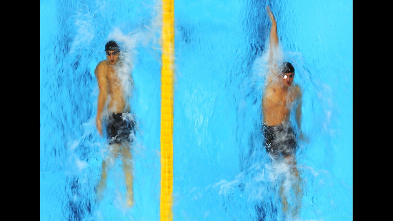 American swimmers Michael Phelps, left, and Ryan Lochte compete in the first semifinal heat of the men's 200-meter individual medley.