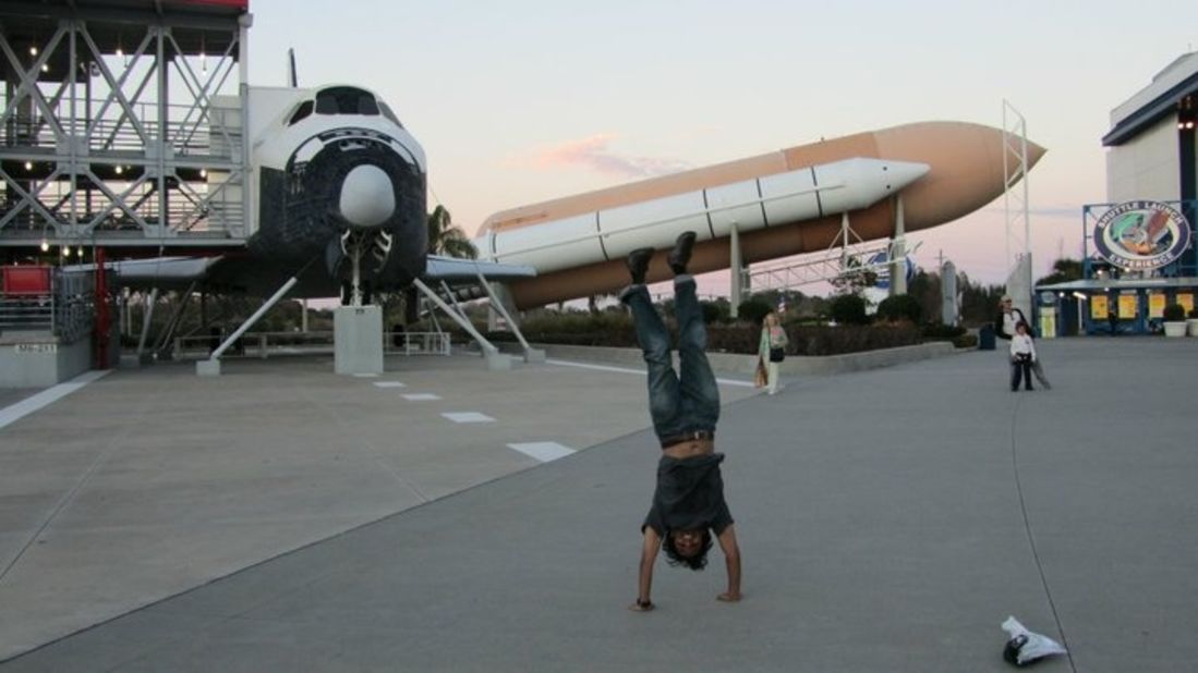 Thomas Thomas Jr.'s travel shots are full of energy and enthusiasm. Here he does one of his classic handstands at <a href="http://www.kennedyspacecenter.com/" target="_blank" target="_blank">NASA's Kennedy Space Center</a> in Florida.
