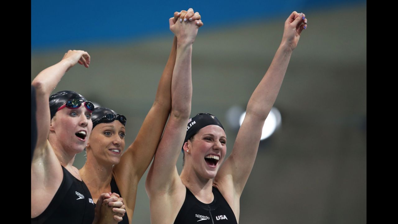 Left to right: Shannon Vreeland, Dana Vollmer and Missy Franklin  celebrate after the U.S. team won gold in the women's 4x200-meter freestyle relay.