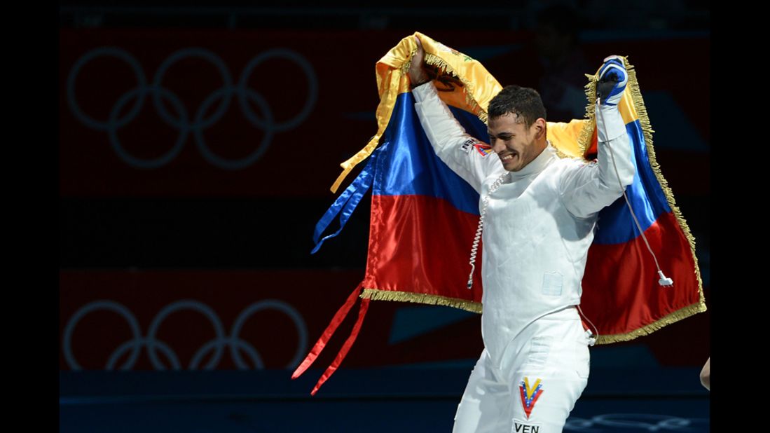 Venezuelan fencer Ruben Limardo celebrates his victory over Norway's Bartosz Piasecki at the end of their gold medal match in men's epee.