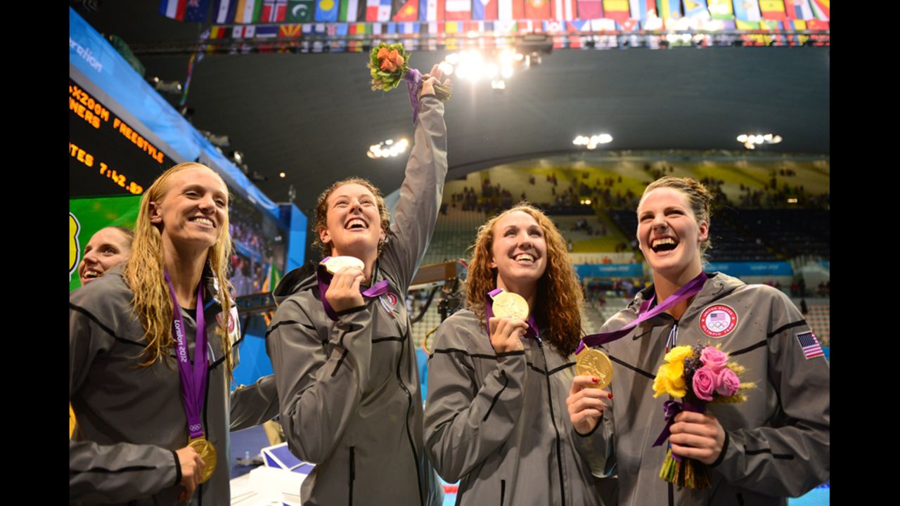 U.S. gold medalists, from left, Dana Vollmer, Allison Schmitt, Shannon Vreeland and Missy Franklin celebrate on the podium after winning the women's 4x200-meter freestyle relay on Wednesday.