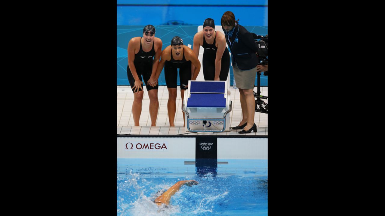 From left, Shannon Vreeland, Dana Vollmer and Missy Franklin watch teammate Allison Schmitt finish first to win the relay.