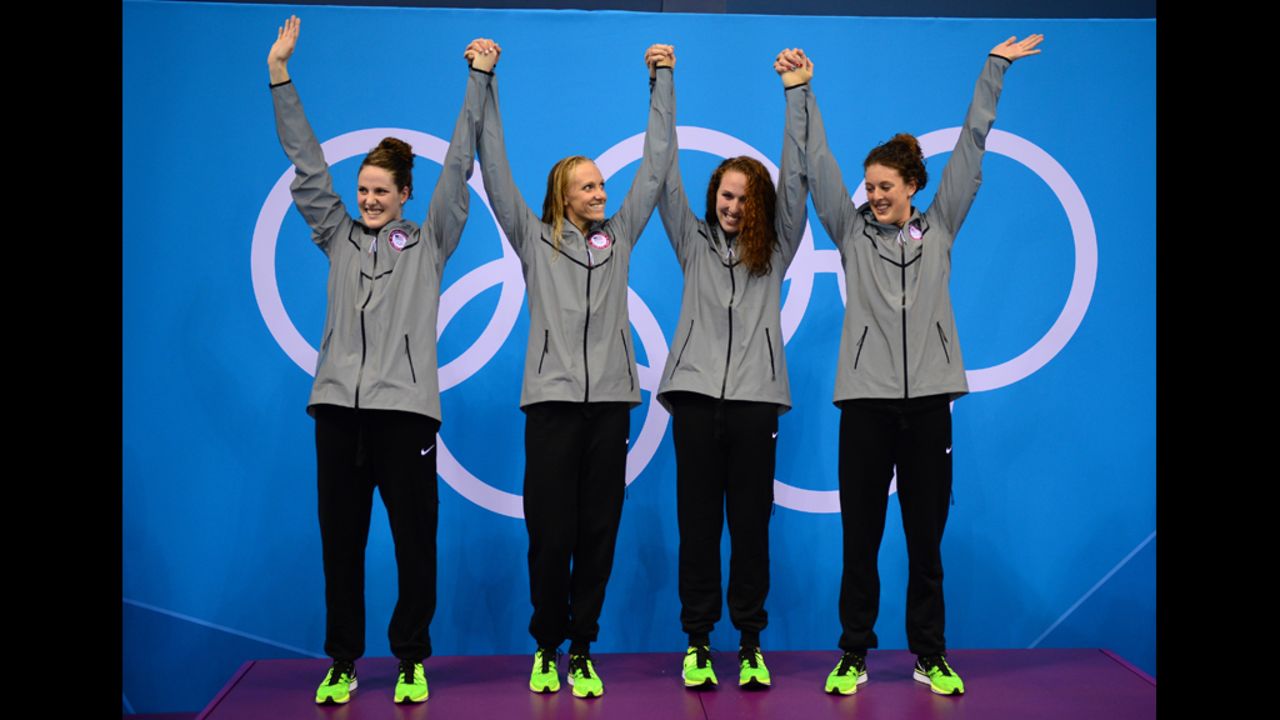Missy Franklin, Dana Vollmer, Shannon Vreeland and Allison Schmitt celebrate on the podium after taking the gold in the women's 4x200-meter freestyle relay on Wedesnday. It was the United States' eighth gold in swimming.