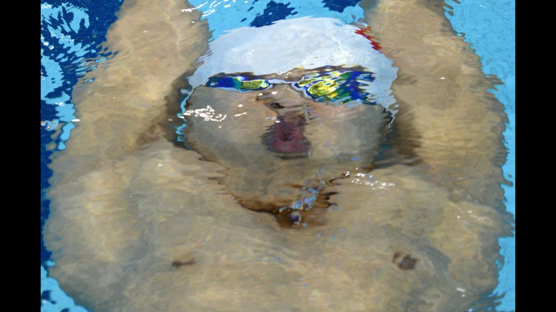 China's Zhang Fenglin competes in the men's 200-meter backstroke semi-finals.