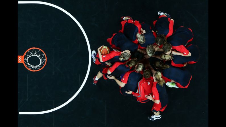 Players from the Czech Republic go into a huddle before starting the second half against Croatia during the women's basketball preliminary round match.