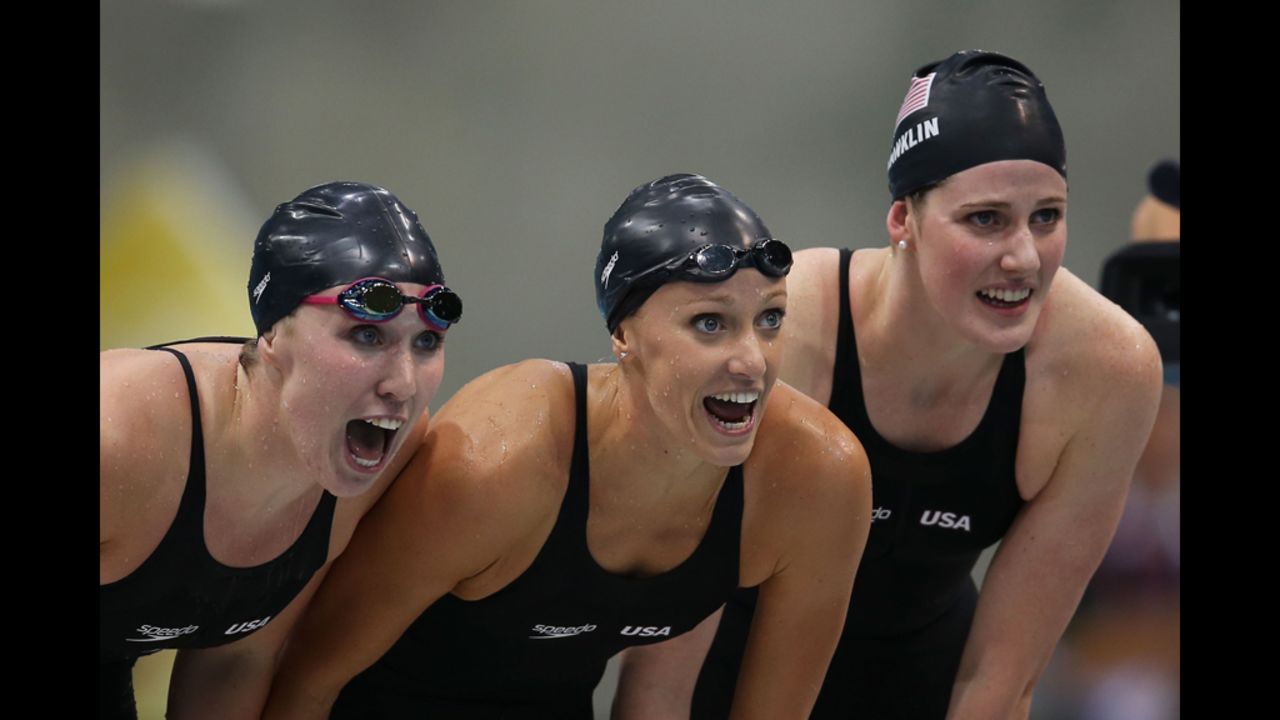 Left to right: Shannon Vreeland, Dana Vollmer and Missy Franklin of the United States encourage teammate Allison Schmitt (not pictured) as they compete in the final of the women's 4x200-meter freestyle relay.