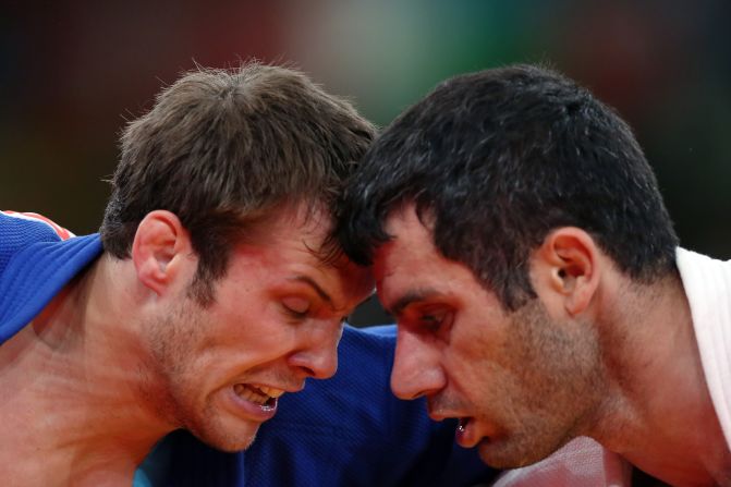Elkhan Mammadov, right, of Azerbaijan faces off with Christophe Lambert of Germany on Wednesday during the men's 90-kilogram Judo match.