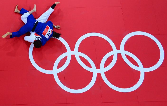 Korea's Hwang Ye-Sul, in white, competes with Italy's Erica Barbieri, in blue, during the women's 70-kilogram Judo contest match Wednesday.