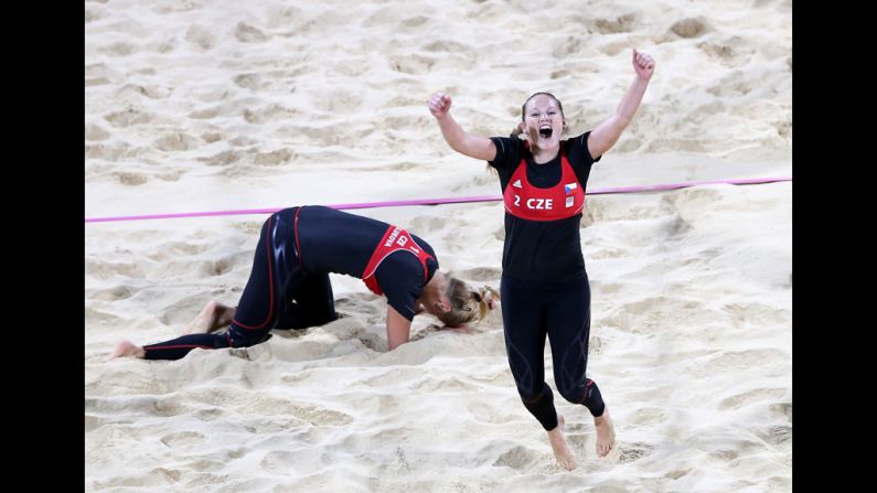 Kristyna Kolocova, right, and Marketa Slukova of the Czech Republic celebrate after winning their match against Australia during women's beach volleyball.