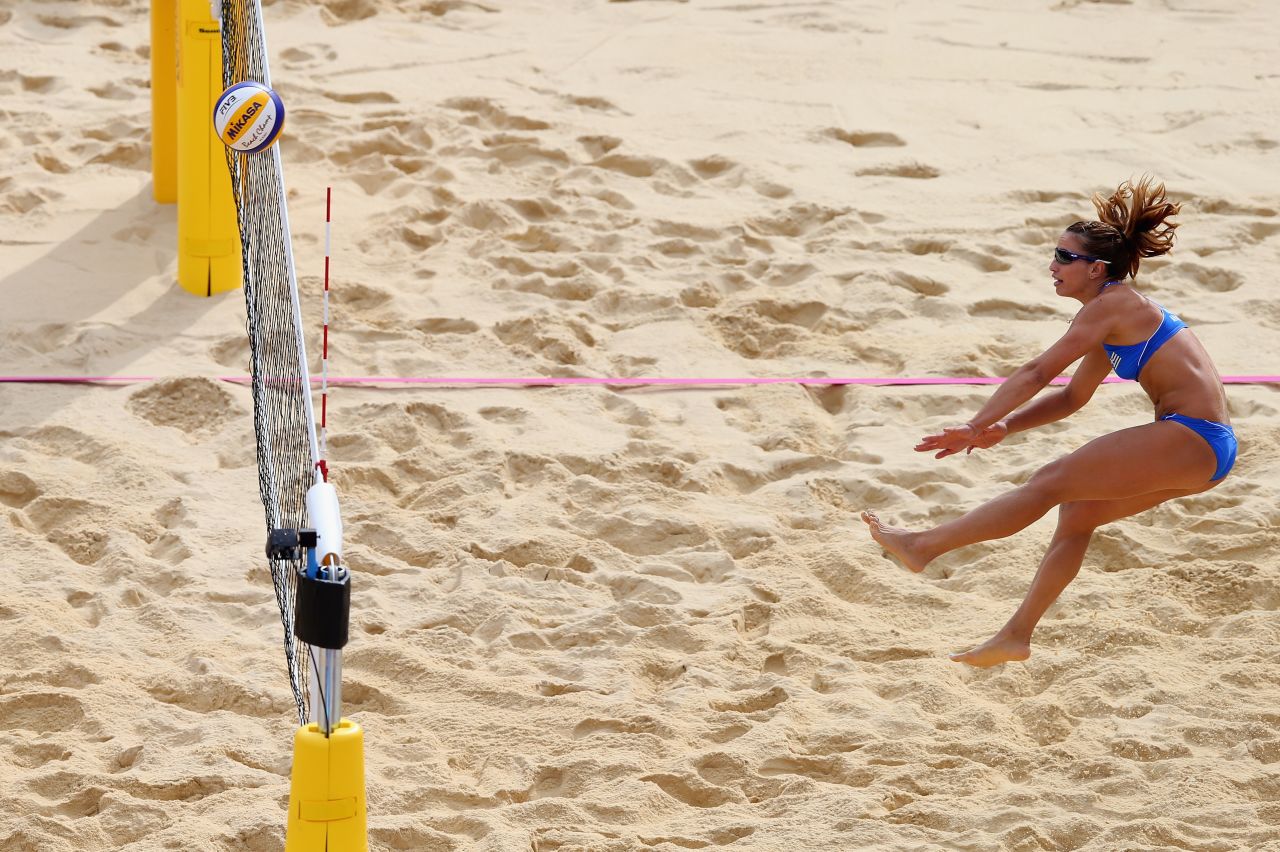 Vasiliki Arvaniti of Greece hits the ball over the net during the women's beach volleyball match between China and Greece on Wednesday.