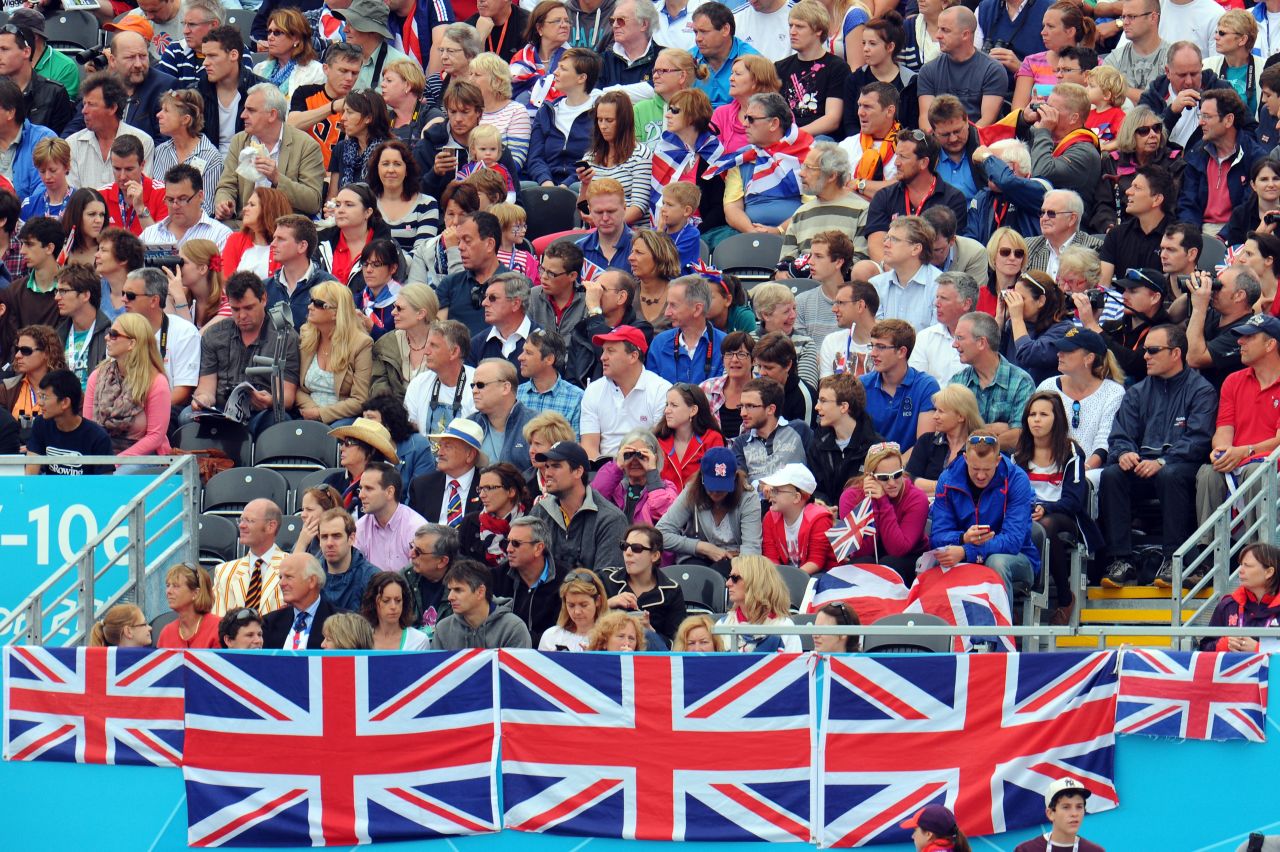 Great Britain fans watch and cheer during the men's single sculls semifinals Wednesday.