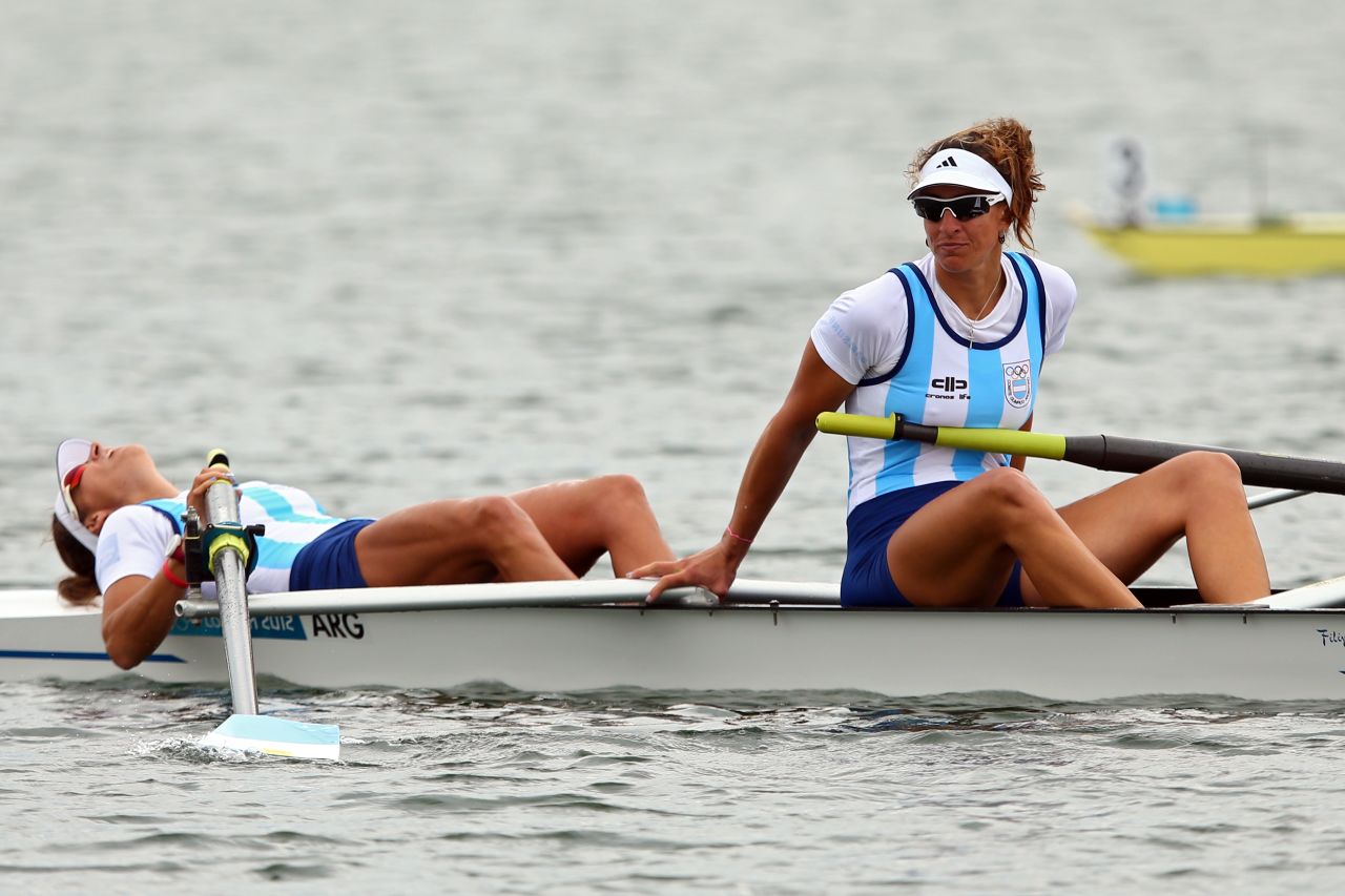 Maria Laura Abalo, left, and Gabriela Best of Argentina look on after finishing the women's pair B rowing finals Wednesday.