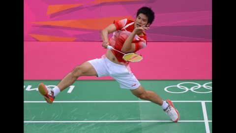 Derek Wong of Singapore returns against Jan O Jorgensen of Denmark during their men's singles badminton match.