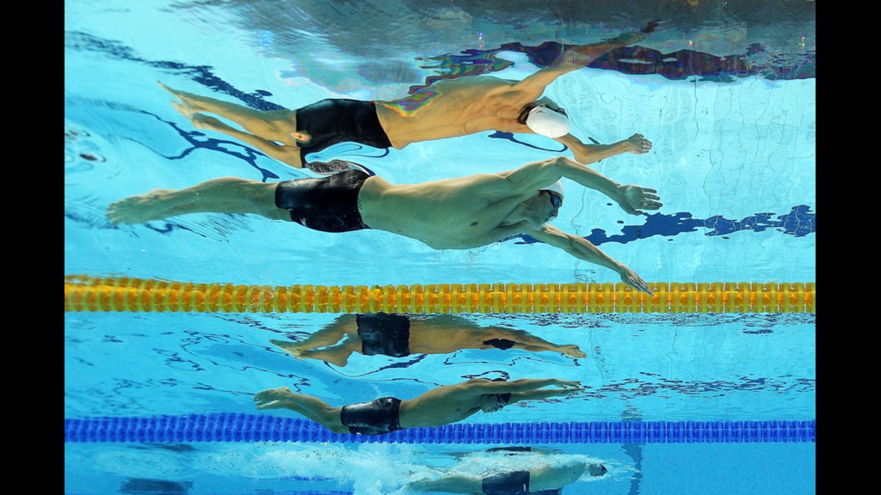 Michael Phelps of the United States, top, competes Wednesday in the men's 200-meter individual medley.