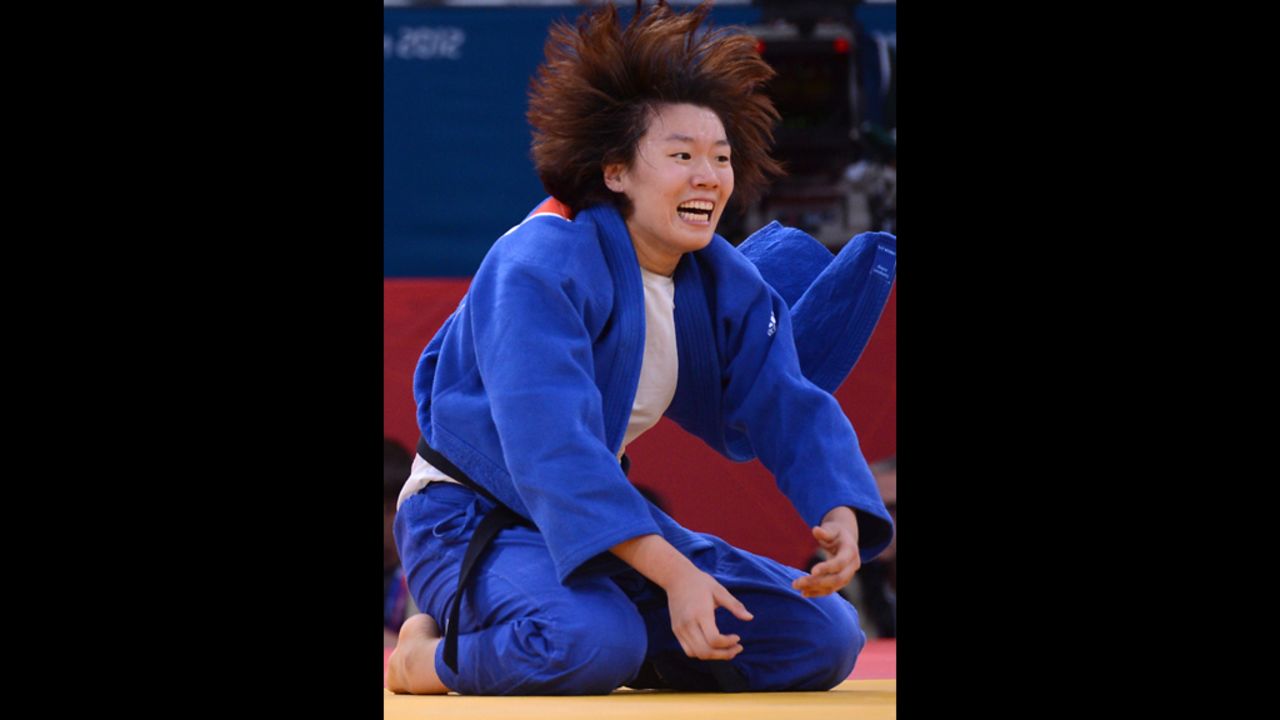 Korea's Hwang Ye-Sul celebrates after defeating Slovenia's Rasa Sraka in women's 70-kilogram judo on Wednesday.