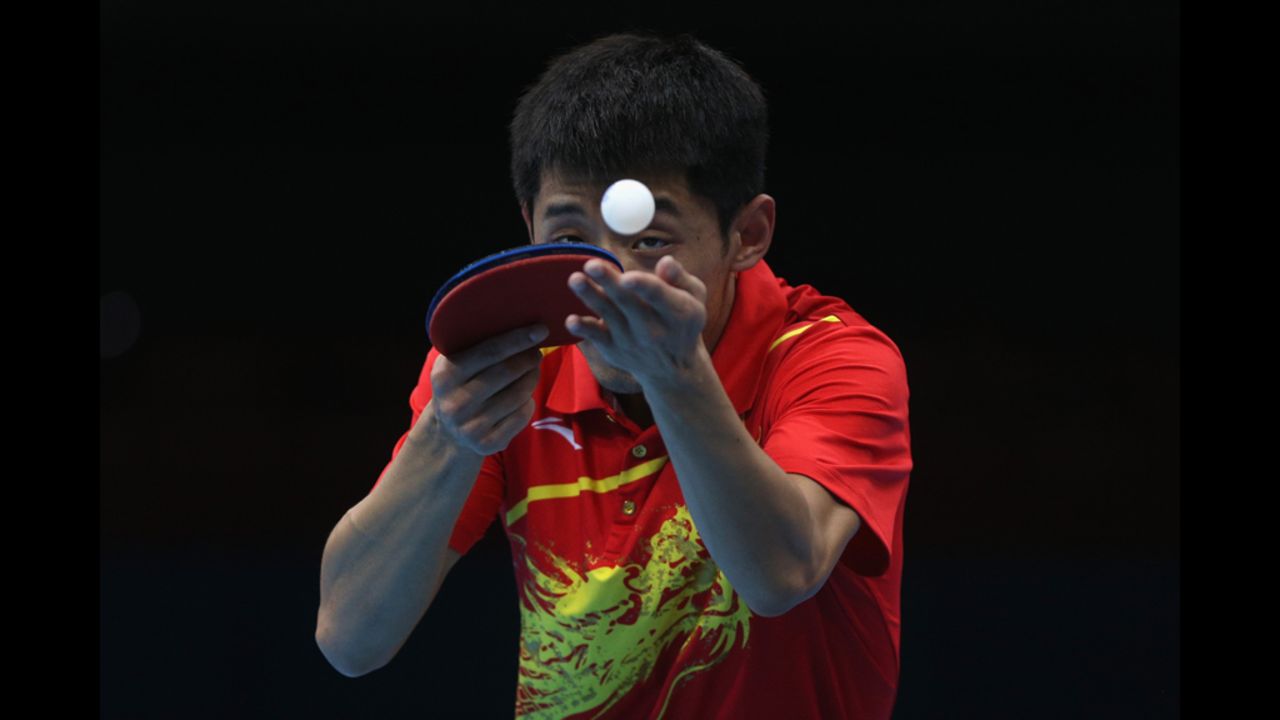 Zhang Jike of China serves during the men's singles table tennis quarter-final match against Tianyi Jiang of Hong Kong on Wednesday.