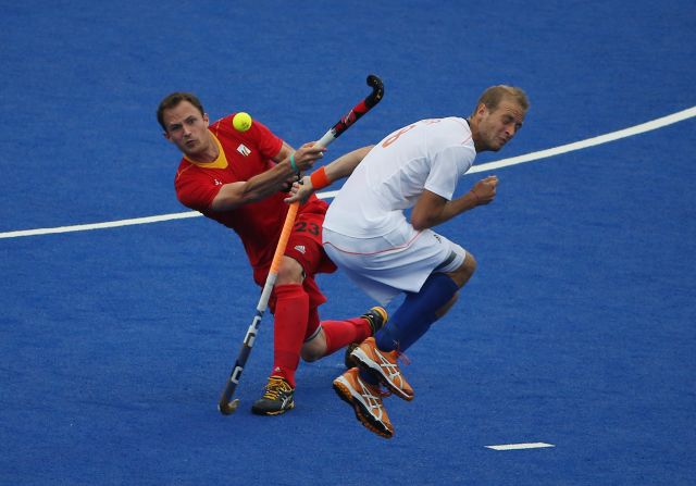 Alexandre de Saedeleer of Belgium hits past Billy Bakker of the Netherlands during their field hockey match at Riverbank Arena in London on Wednesday.