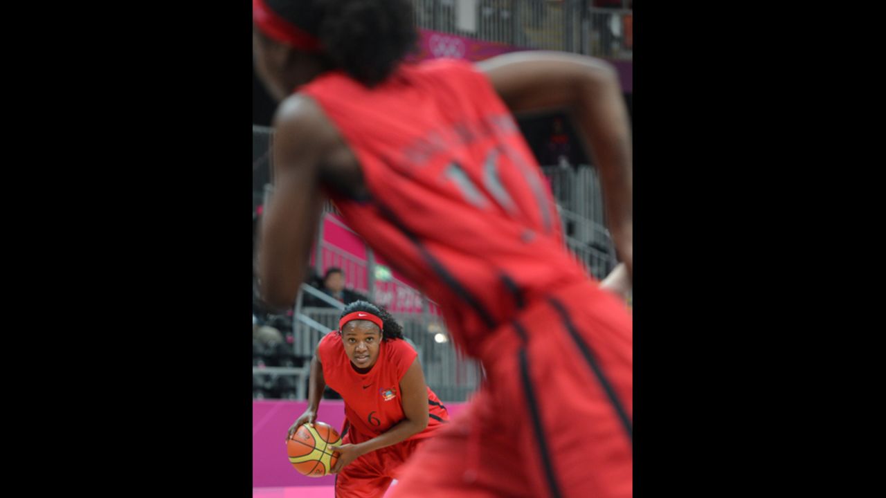 Angolan forward Felizarda Jorge looks to pass Wednesday during the preliminary round basketball game against China.
