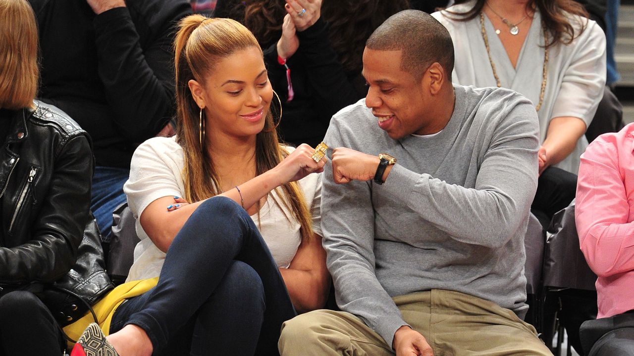 Jay-Z, right, and wife Beyonce celebrate at a New Jersey Nets game February 20, 2012 in New York City. 