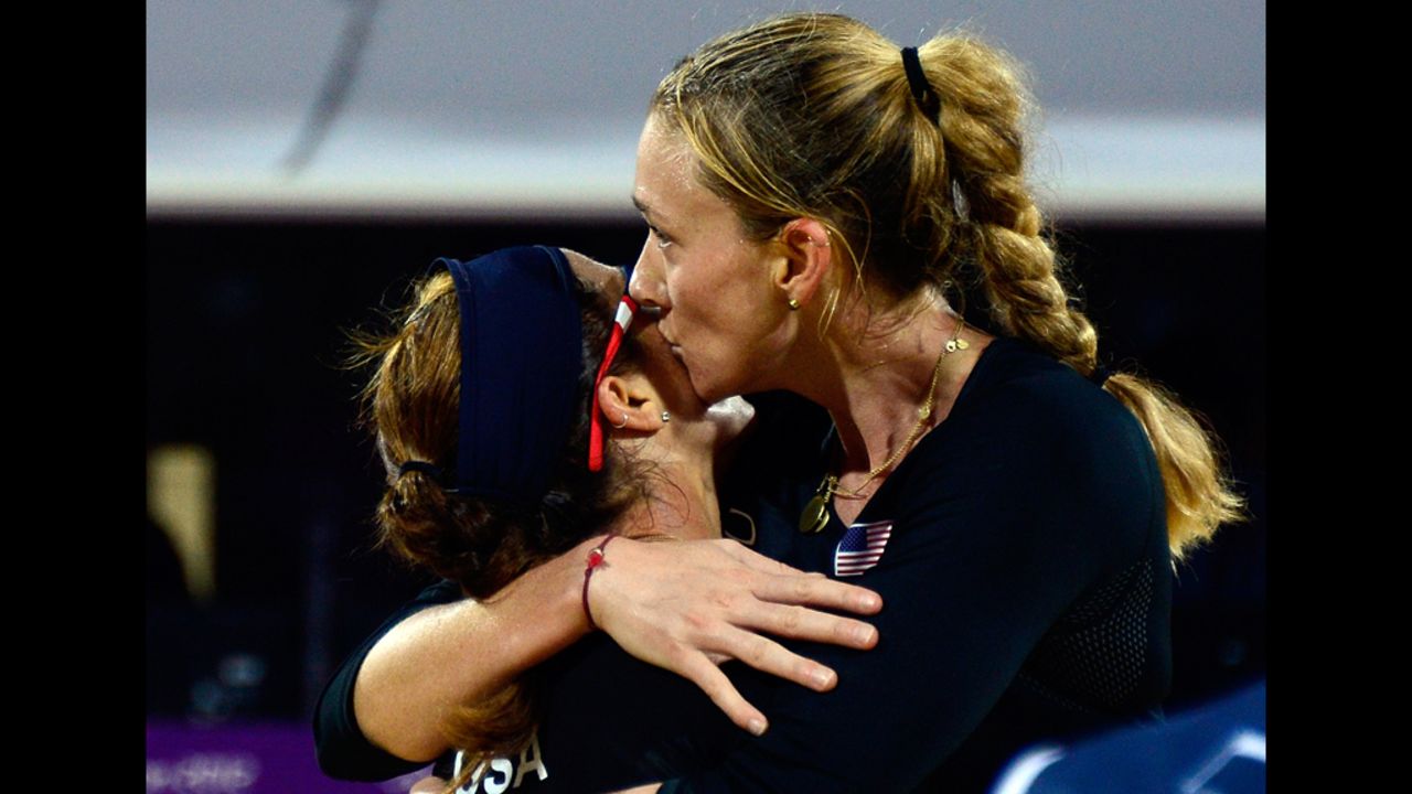 Misty May-Treanor and Kerri Walsh of the United States celebrate their win against Austria's Doris Schwaiger and Stefanie Schwaiger in the women's beach volleyball preliminary phase group C match.