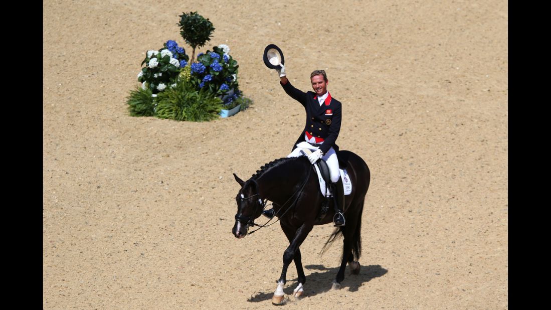Britain's Carl Hester rides Utopia in the dressage grand prix at Greenwich Park in London.