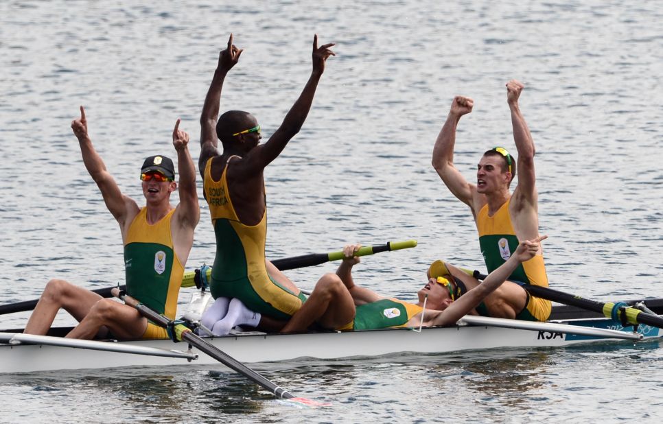 South African rowers celebrate after winning the gold medal in the men's lightweight four final A rowing event.