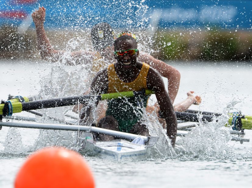 Sizwe Ndlovu of South Africa celebrates after he and his team won the gold in the lightweight men's four final rowing event.