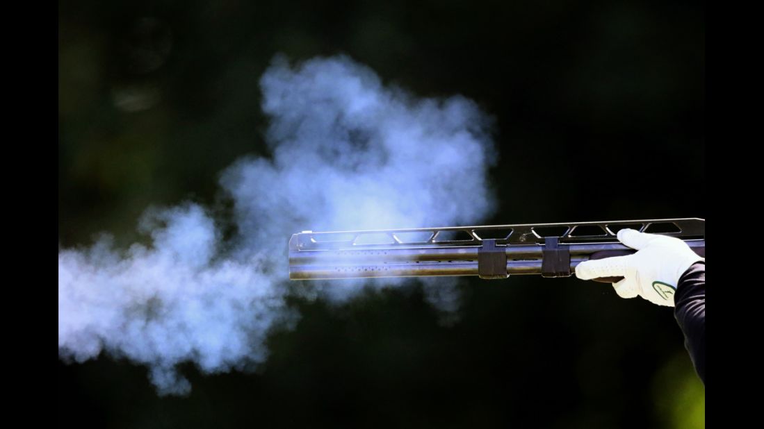 Hungary's Richard Bognar fires his rifle in the men's double trap qualification round at the Royal Artillery Barracks in London. 
