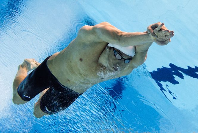 Michael Phelps of the United States competes in the men's 100-meter butterfly heat.