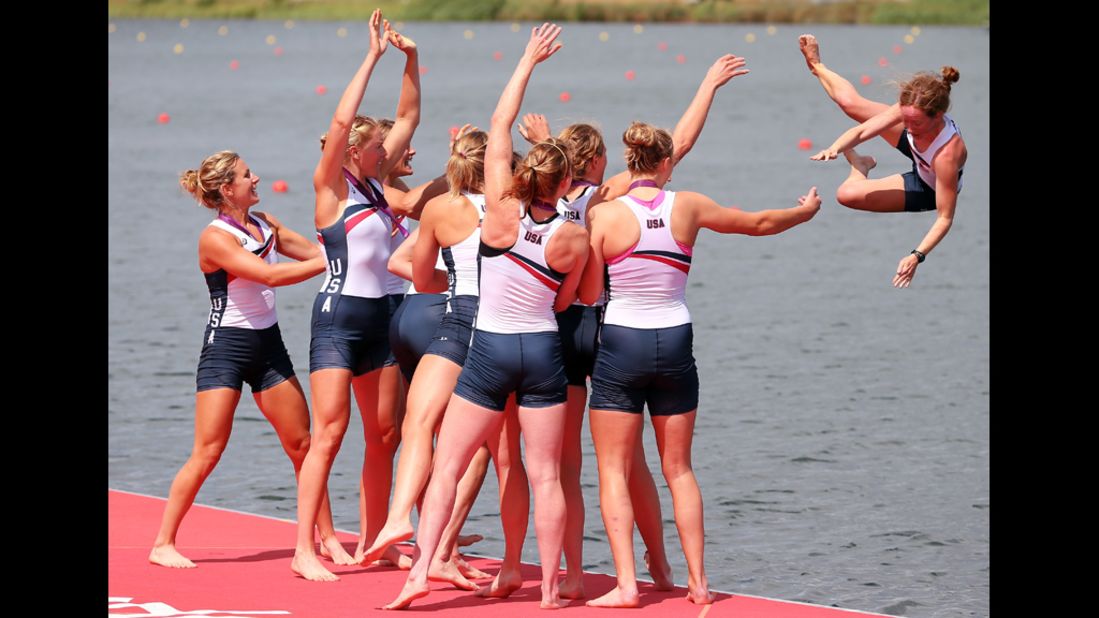 The U.S. rowing team throw Mary Whipple into the water as they celebrate winning gold in the women's eight rowing event. 