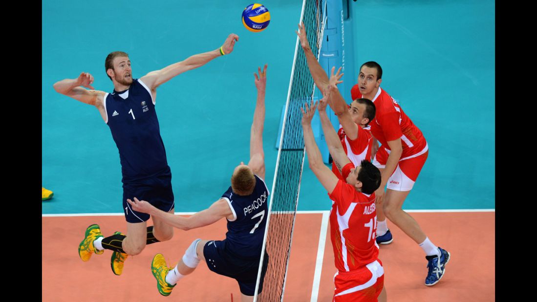 Australia's Aidan Zingel, left, spikes next to teammate Harrison Peacock during a men's preliminary volleyball match against Bulgaria.
