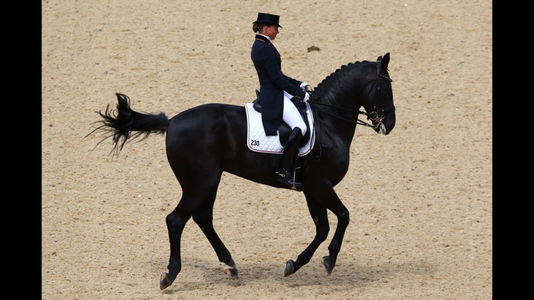 Dorothee Schneider of Germany rides Diva Royal in the dressage grand prix in Greenwich Park in London.