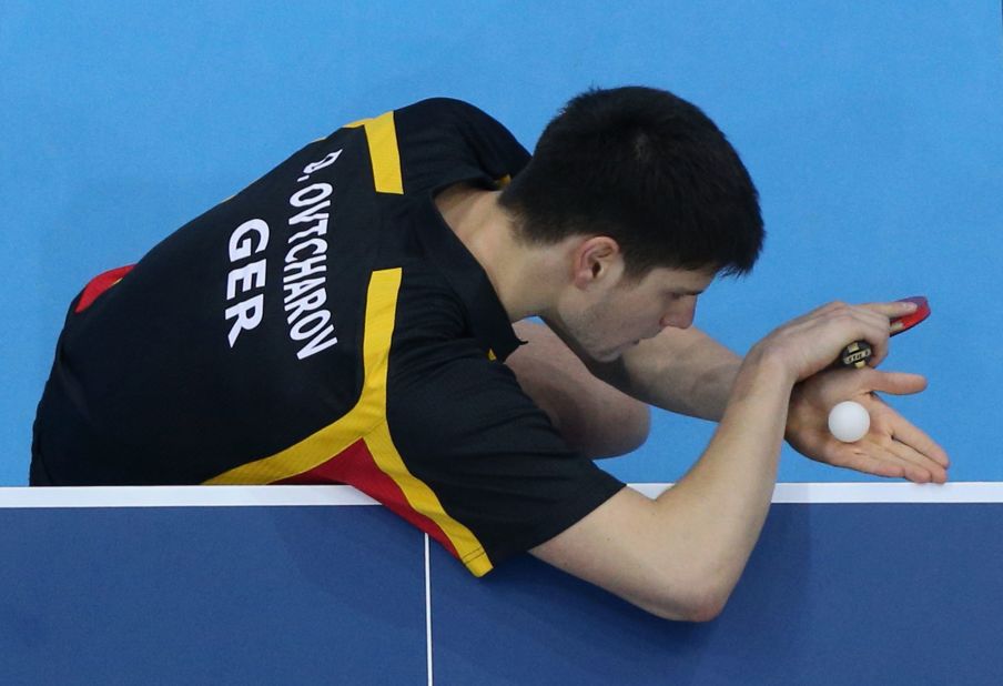 Germany's Dimitrij Ovtcharov serves during a men's singles table-tennis bronze medal match against Chih-Yuan Chuang of Taiwan.