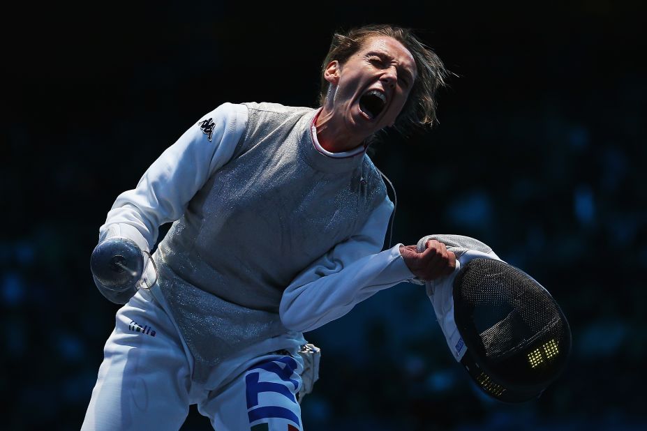 Italy's Valentina Vezzali is exuberant after beating France's Astrid Guyart in the women's foil team fencing semifinal.