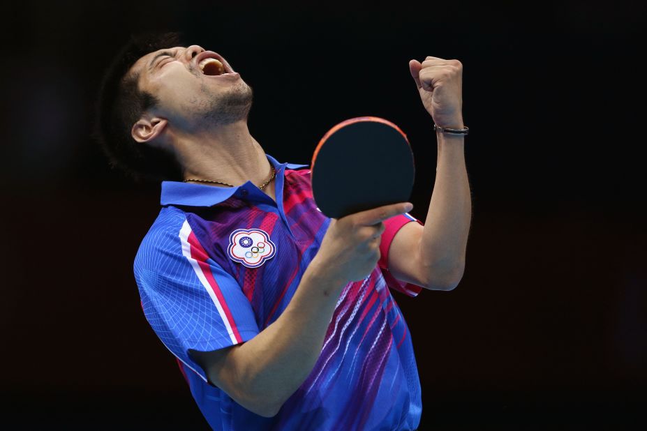 Chih-Yuan Chuang of Taiwan celebrates a point during the men's singles table-tennis bronze medal match against Germany's Dimitrij Ovtcharov.