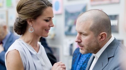 Apple design chief Jonathan Ive chats with Kate Middleton at an event in London on July 30.