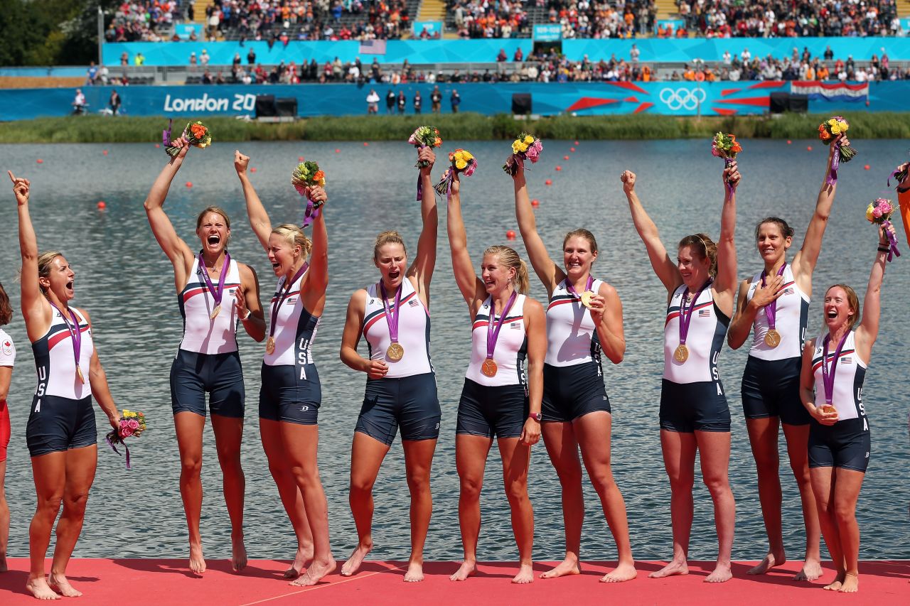Members of the U.S. rowing team celebrate with their gold medals during the medal ceremony after the women's eight final at Eton Dorney in Windsor, England.