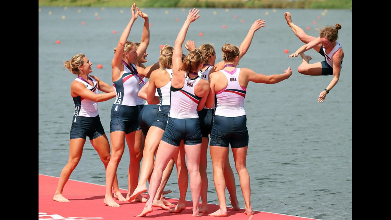 The U.S. team throws their cox Mary Whipple into the water after their big win.