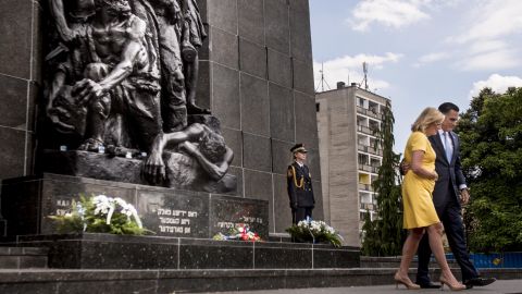 Mitt Romney and his wife, Ann, after a visit Tuesday to the Monument to the Ghetto Heroes in Warsaw, Poland.