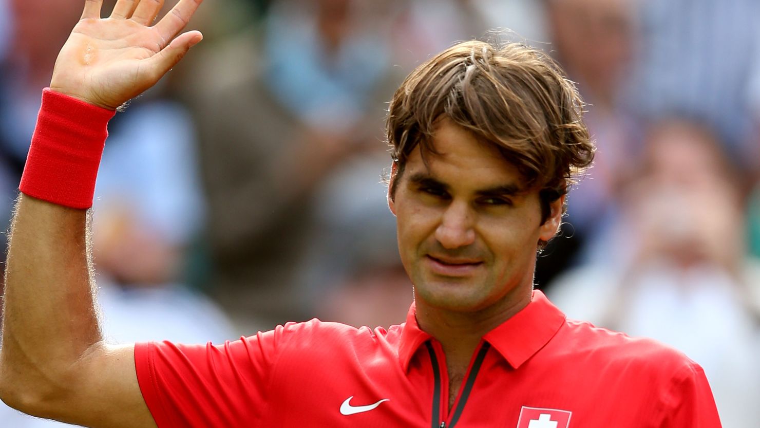 Roger Federer celebrates his straight sets victory over John Isner in the Olympic men's singles quarterfinals. 