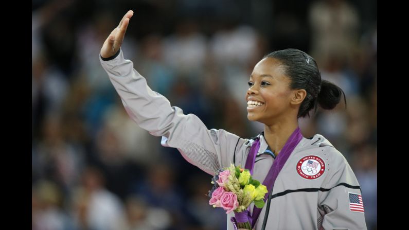 U.S. gymnast Gabrielle Douglas celebrates on the podium after winning the gymnastics women's individual all-around final on Thursday.