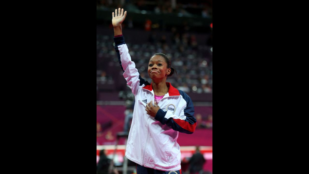 Douglas waves to the crowd after winning the gold medal.