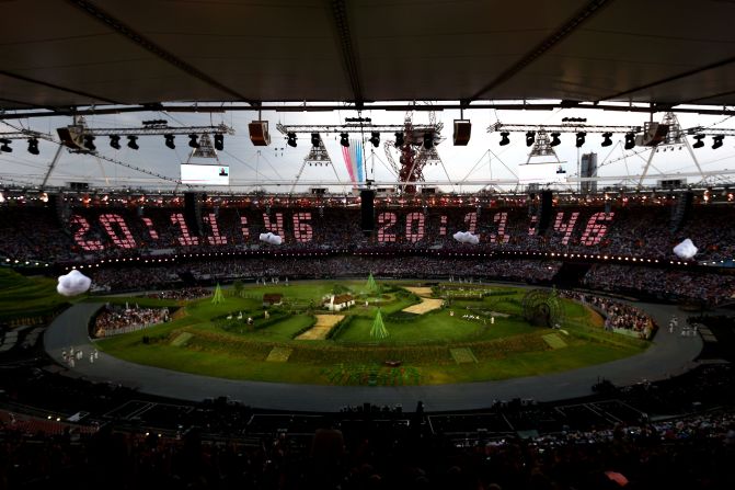 The countdown to the start of the opening ceremony is projected across the stands while the Royal Air Force aerobatic team, the Red Arrows, flies over the Olympic Stadium. The opening ceremony of the London 2012 Olympic Games was held on Friday, July 27. Check out photos from the<a href="index.php?page=&url=http%3A%2F%2Fwww.cnn.com%2F2012%2F08%2F12%2Fworld%2Fgallery%2Folympic-closing-ceremony%2Findex.html" target="_blank"> closing ceremony.</a>