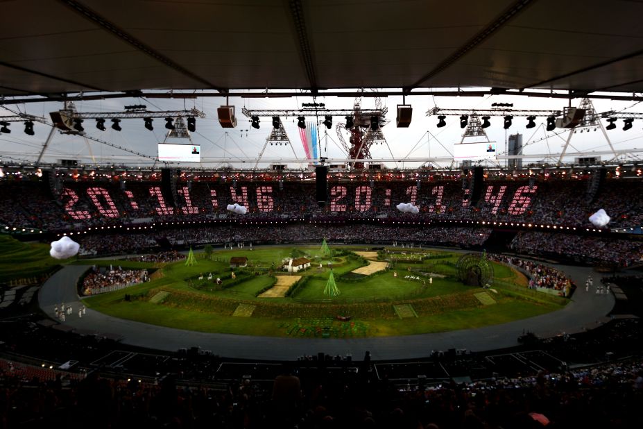 The countdown to the start of the opening ceremony is projected across the stands while the Royal Air Force aerobatic team, the Red Arrows, flies over the Olympic Stadium. The opening ceremony of the London 2012 Olympic Games was held on Friday, July 27. Check out photos from the<a href="http://www.cnn.com/2012/08/12/world/gallery/olympic-closing-ceremony/index.html" target="_blank"> closing ceremony.</a>