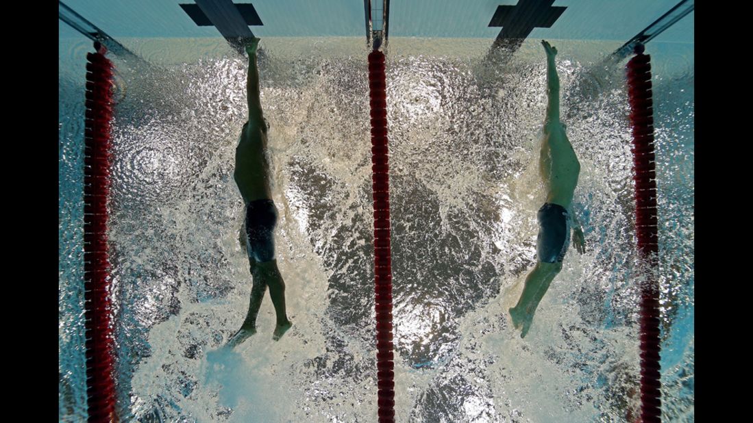 Cullen Jones, left, of the United States and Cesar Cielo of Brazil touch the wall at the finish the men's 50-meter freestyle semifinal.