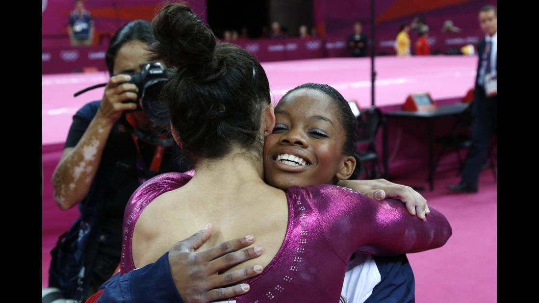 U.S. gymnast Gabby Douglas, right, embraces teammate Alexandra Raisman after winning the gymnastics women's individual all-around final.
