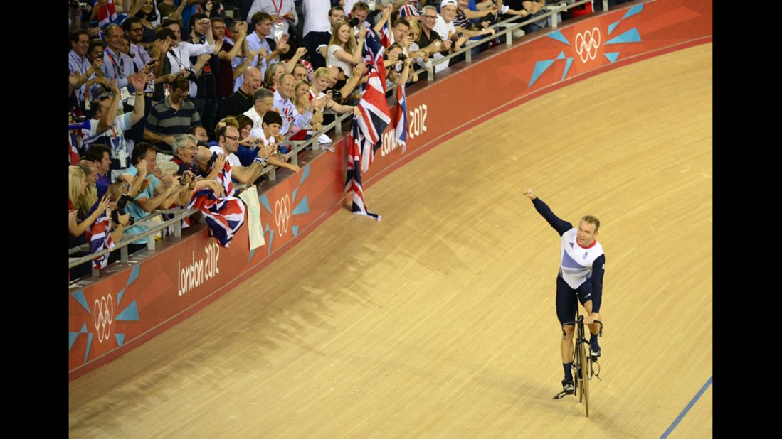 Great Britain's Chris Hoy celebrates after winning the men's team sprint gold final.
