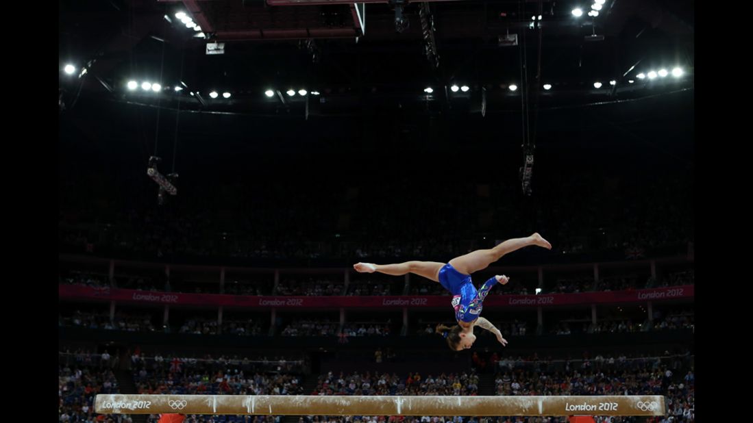 Italy's Carlotta Ferlito competes on the balance beam in the artistic gymnastics women's individual all-around final.