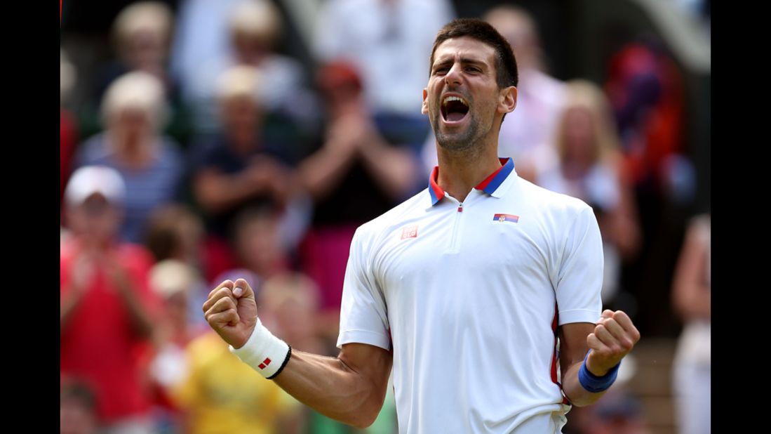 Serbia's Novak Djokovic celebrates after defeating France's Jo-Wilfried Tsonga in the men's singles tennis quarter-finals.