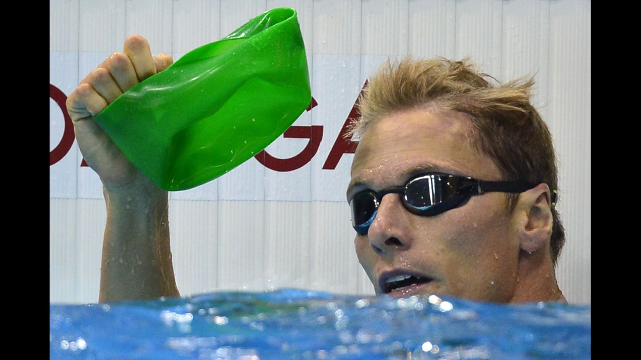 South Africa's Roland Schoeman rescues his bath toy from the bottom of the pool.